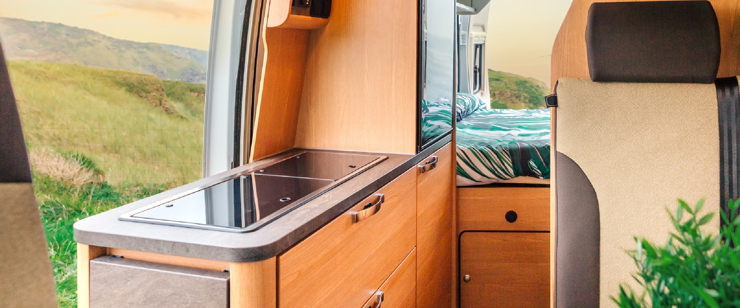 Image of the wood interior and storage solution of an RV. 