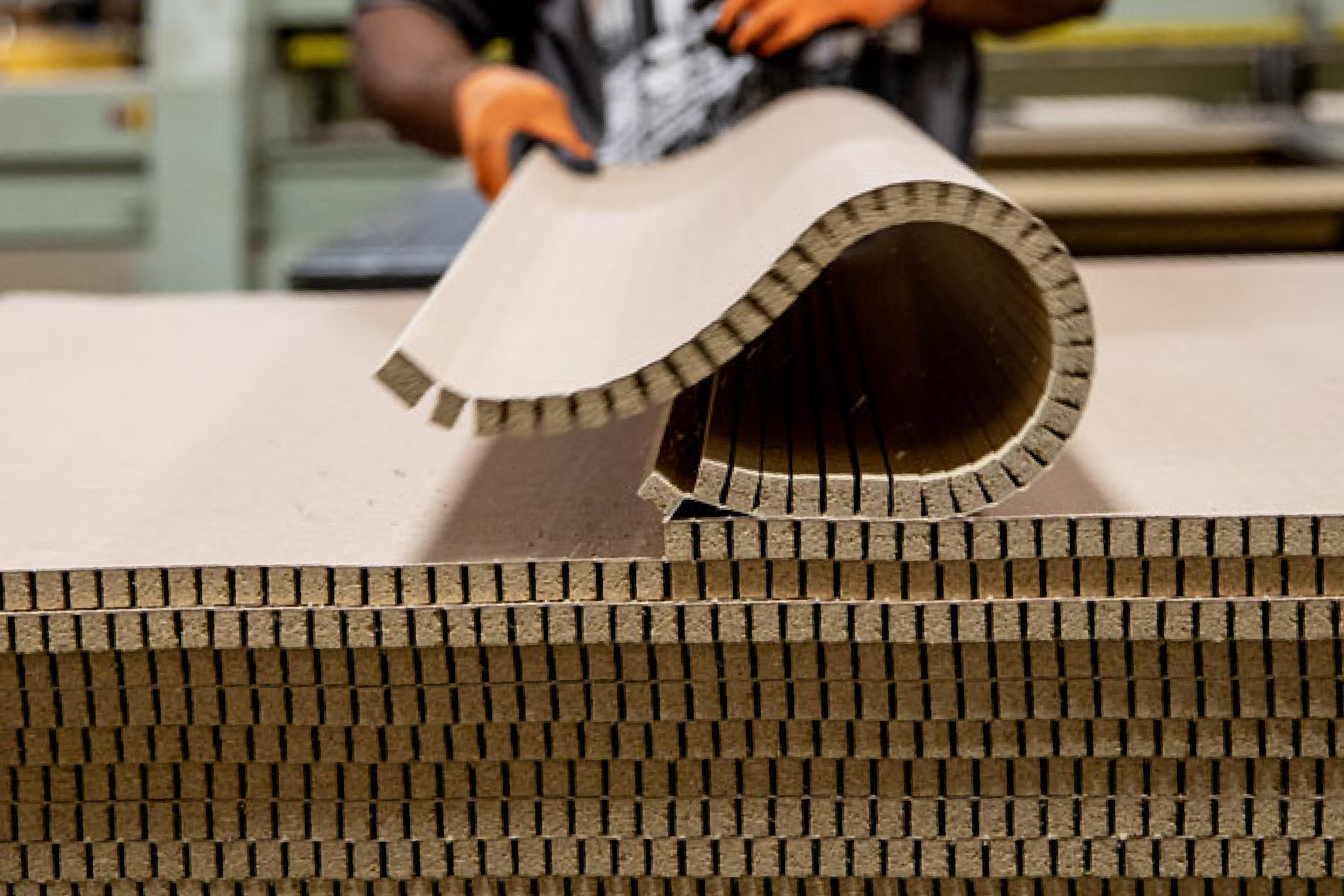 man holding a curved panel of kerfkore