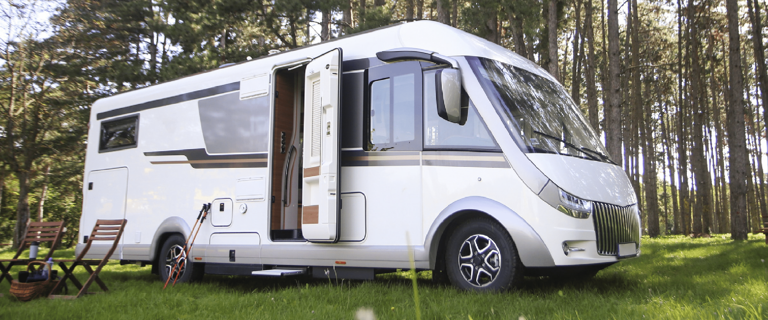 image of an rv in front of trees