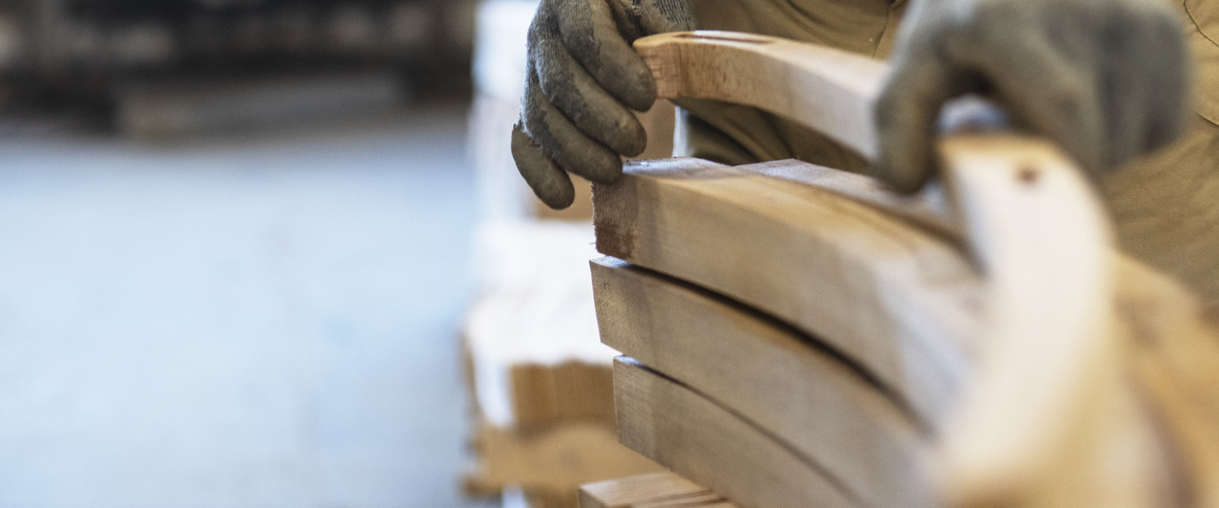 fabricator holding curved wood