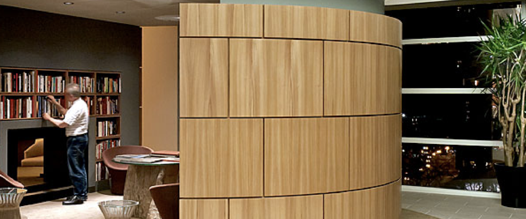 curved wall feature in front of a library wall