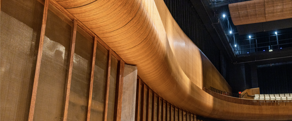 a curved warm wood balcony edge 
